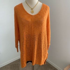 Soft orange knitted quarter sleeve sweater